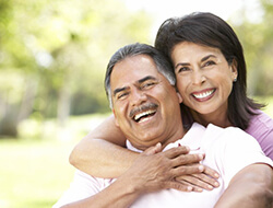 Laughing couple with dental implants in Friendswood