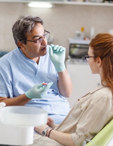 Dentist discussing LightWalker laser dentistry treatment with dental patient