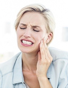 Woman in pain before root canal therapy
