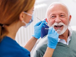 Mature man smiling during dental checkup