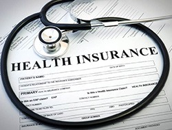 Health insurance document with stethoscope